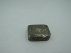 A Georgian silver vinaigrette of small form having bright cut star burst decoration and plain