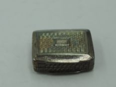 A Georgian silver vinaigrette of miniature form having bright cut decoration and plain cartouche