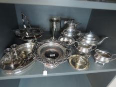 A selection of silver plate including chamber stick, four piece tea set, gallery tray, table