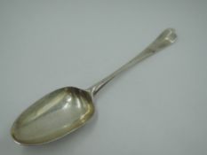 An early 18th Century Georgian silver table spoon of Hanoverian form bearing crest to reverse of