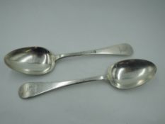 A pair of Victorian silver dessert spoons of Old English form bearing Unicorn crest to terminals,