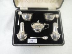 A cased silver five piece cruet set of plain bowl and baluster form, having bakelite liners,