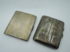 Two HM silver cigarette cases of small rectangular form, both having engine turned decoration,