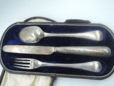 A Victorian child's silver three piece cutlery set having extensive decoration and monogrammed