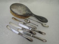 A selection of HM silver including silver handled butter knives, hair brush, souvenir spoon etc,