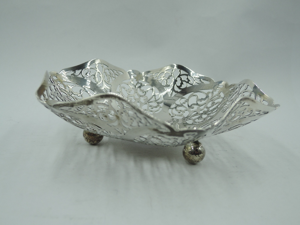 A 1930's silver trinket dish having shaped and pierced decoration and trefoil bun feet, Birmingham - Image 2 of 2