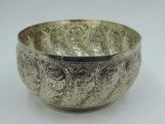 An Indian style white metal bowl having moulded fluted scroll decoration, tests as silver, approx