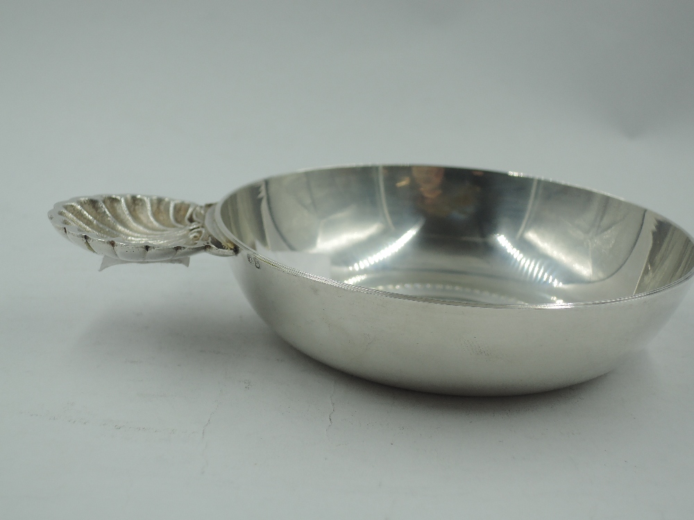 A white metal wine taster of traditional circular form having moulded scallop shell handle, bears - Image 2 of 4