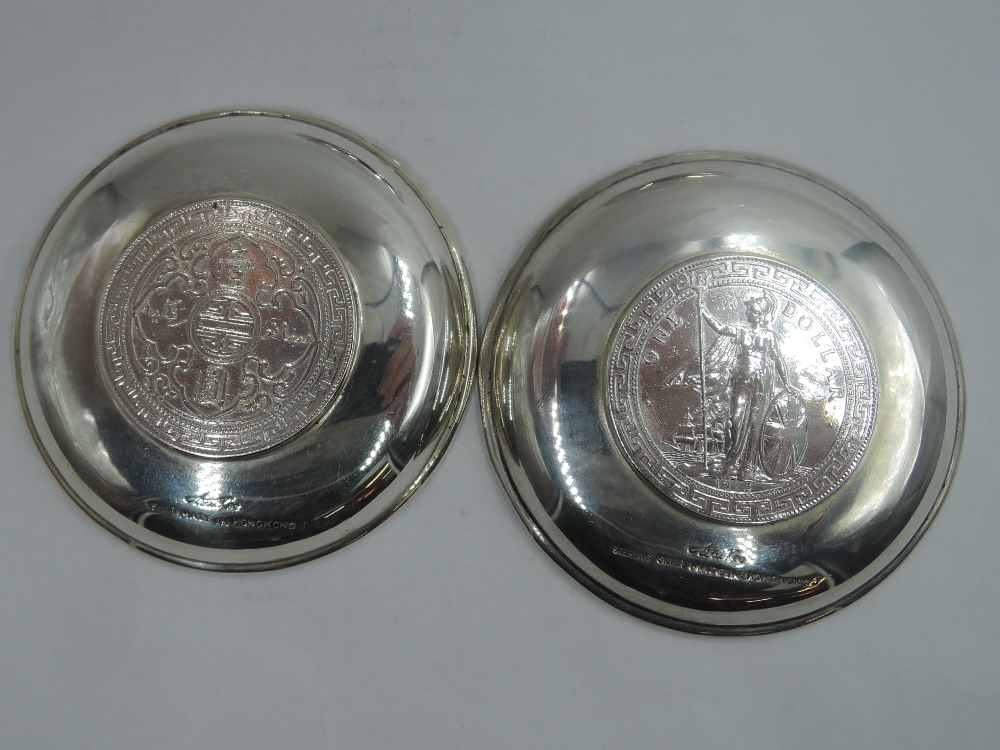 Three Chinese silver trinket dishes, two bearing British Trade dollar coins to base and other - Image 2 of 4