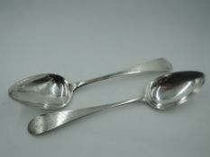 A pair of Georgian Scottish silver table spoons bearing monogram to terminals, Edinburgh 1802,