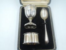 A cased silver Christening egg cup and napkin ring set of plain form, Birmingham 1939/40, Arthur