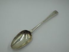 A Georgian silver table spoon of Hanoverian form bearing monogram to terminal, London hallmark, date