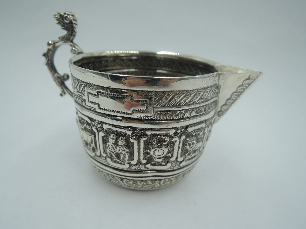 A Victorian silver cream jug having zodiac panel decoration, plain cartouche and cast dog mask - Image 2 of 3