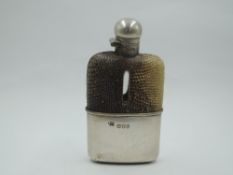 A Victorian silver hipflask of petite form having snake skin cover and bayonet lid, London 1897,
