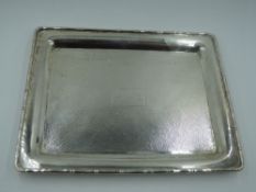 A Chinese silver dressing table tray of small rectangular form having rim modelled as bamboo and