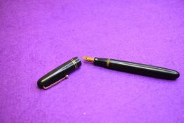 A Mabie Todd & Co Swan 6261 Self Filler Leverfill, in black with two bands to the cap and a Swan No2