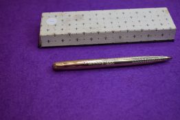 A Parker rolled gold ballpoint pen in original box