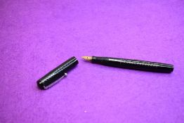 A Mabie Todd & Co Self filler leverfill fountain pen in black with chased design with Swan No1