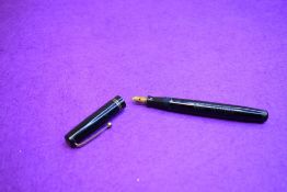 A Mabie Todd & Co Swan L212/60 Leverless twist filler, in black with two bands to cap and a Swan No2