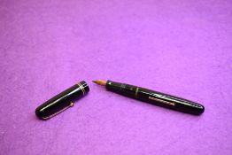 A Mabie Todd & Co Swan 3260 Calligraph Self Filler Leverfill, in black with two bands to the cap and