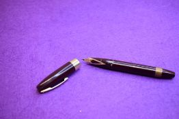 A Sheaffer PFM (Pen For Men) III snorkel fill fountain pen in burgundy with broad band to lip of cap