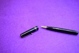 A Mabie Todd Swan 1060 leverless fountain pen in black with three bands to the cap having Swan 4
