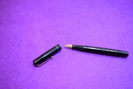 A Mabie Todd Swan 6160 Self-filler leverfill fountain pen in black with one broad band to cap having