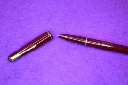 A Parker 17 fountain pen in burgundy with single narrow band to cap. Approx 13.2