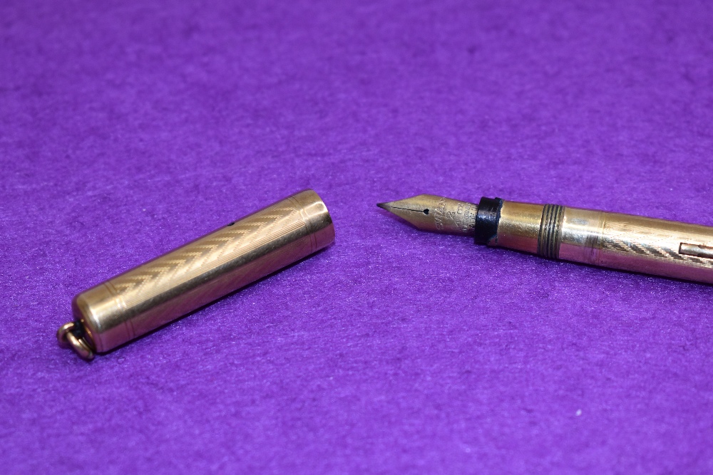 A Mabie Todd Swan Ladys leverfill fountain pen in gold having a Swan 2 nib. Approx 10cm - Image 2 of 2