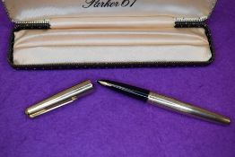 A Parker 61 fountain pen in rolled gold with engine turned decal. In original Parker 61 box.