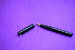 A Mabie Todd & Co Self filler leverfill fountain pen in black with chased design with Swan No2