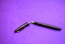 A Sheaffer Statesman fountain pen with plunger fill in burgundy with broad band to cap having a