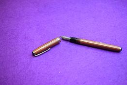 An R Esterbrook lever fill fountain pen in brown stripe with single band to cap having Esterbrook