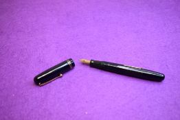 A Mabie Todd & Co Swan 3220 Self Filler Leverfill, in dark blue with two bands to the cap and a Swan
