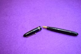 A Mabie Todd Swan 4461 leverless fountain pen in black with two narrow and one broad bands to the