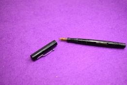 A Mabie Todd Swan SM1 60 Minor leverfill fountain pen in black having a Swan 1 nib. Approx 13.1cm