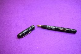 An R Esterbrook Relief 2-L lever fill fountain pen in black marble with single narrow band to cap