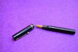 A Sheaffer Lifetime leverfill fountain pen in black with two narrow bands to the cap having a