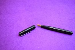 A Mabie Todd & Co Self filler leverfill fountain pen in black with chased design with Warrented 14ct