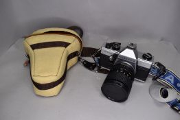 A Praktica MTL camera with Tokina 28-70mm zoom lens