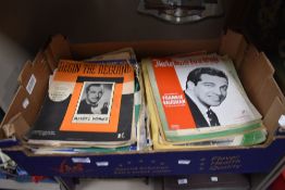 A box of vintage sheet music.