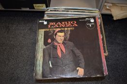 A selection of vinyl record albums including pop and rock interest