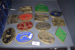 A selection of brass steam gathering and transport badges including Lancaster and Barton