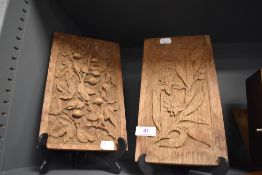 Two hand carved wooden oak panels in an arts and crafts design