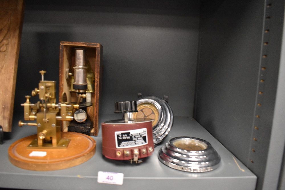 A selection of scientific instruments including field microscope