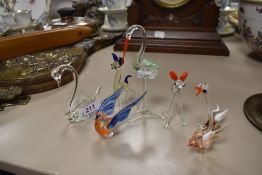 A collection of miniature glass animals.