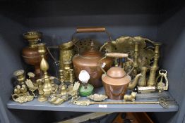 A selection of brass and copper wares including stove kettle and date calendar