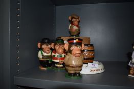 A Guinness advertising ashtray in the form of a barrel and a set of PG tips figures