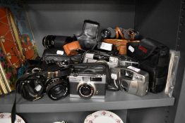 A selection of cameras and photography equipment including Tamron CF tele macro and Yashica FX -