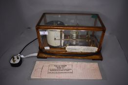 An Edwardian weather station barometer The Cyclo Stormograph in glass case